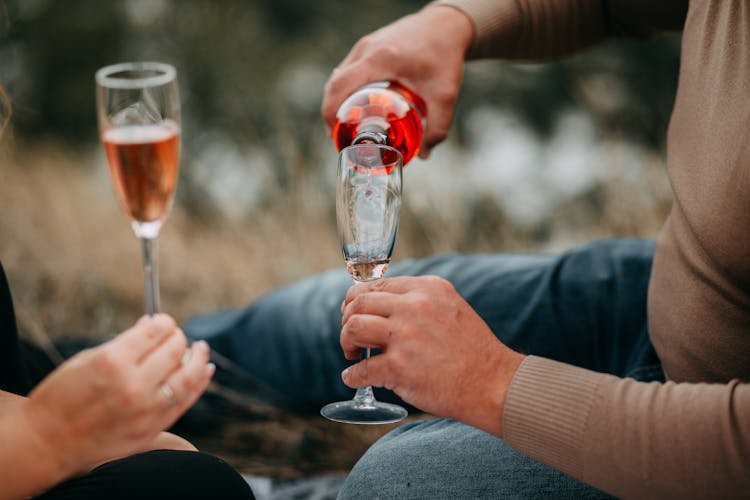 Man Pouring Wine Into Glass