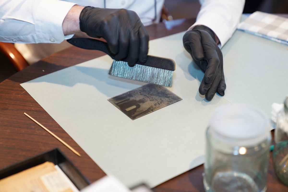 Soft brush being used on a photographic print