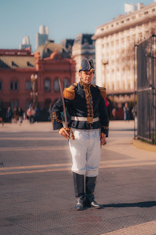 Free Argentine soldier in traditional uniform stands guard at Casa Rosada, Buenos Aires. Stock Photo