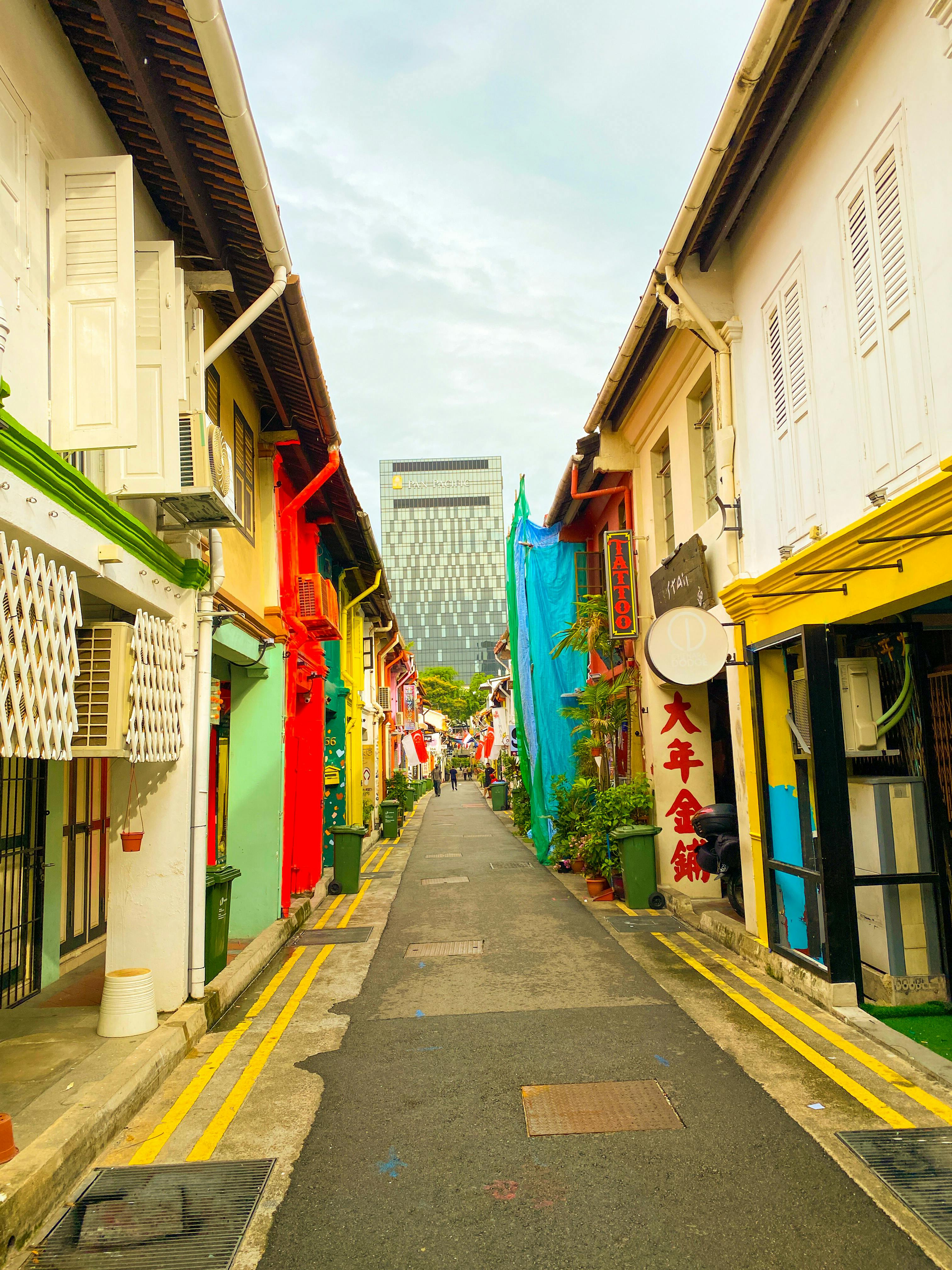 Colourful heritage shophouses lining a narrow street in Chinatown Singapore