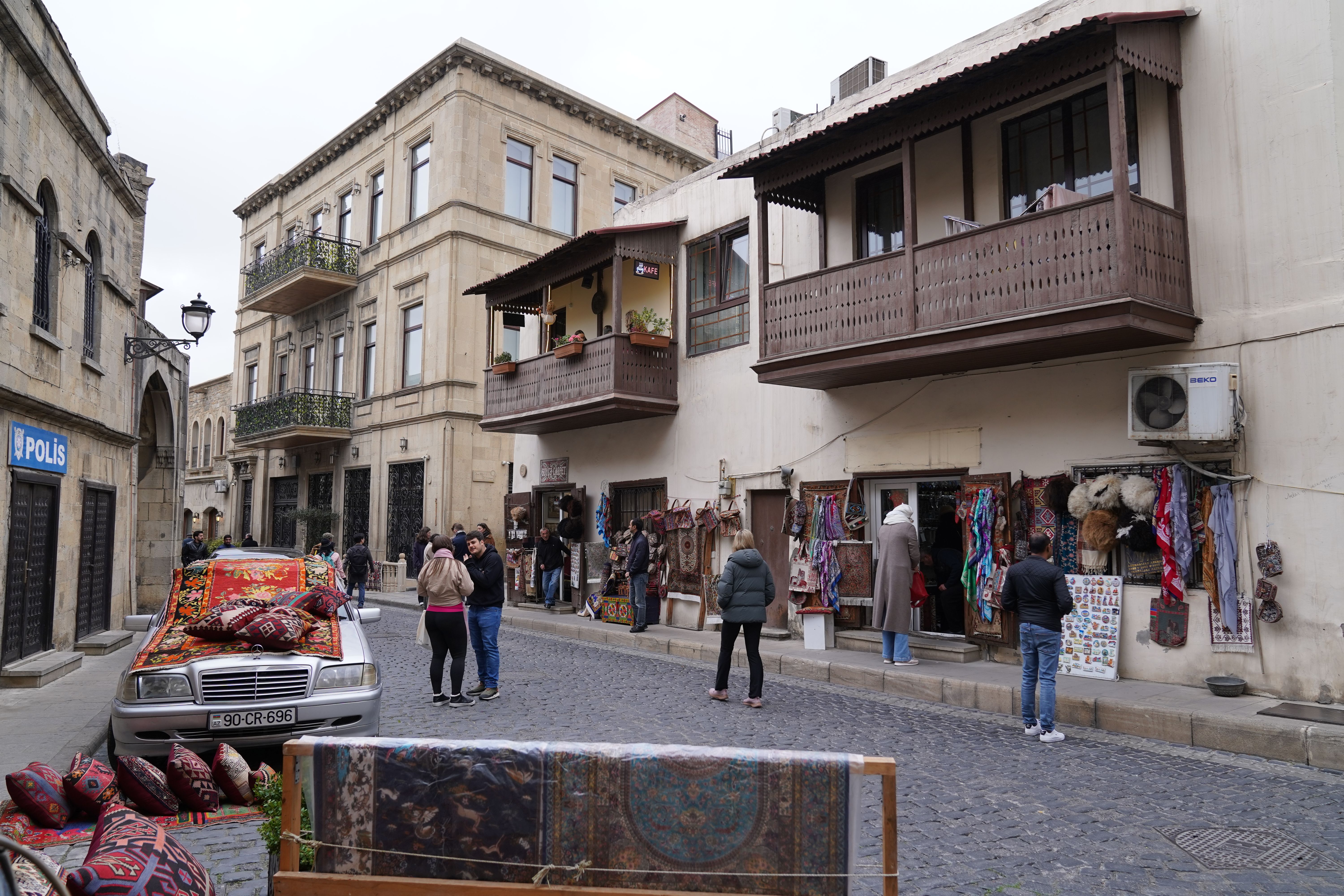 Crowded Nizami Street in Baku, Azerbaijan, with people enjoying the evening, highlighting awareness for valuables