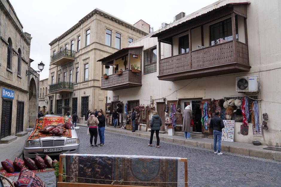 Crowded Nizami Street in Baku, Azerbaijan, with people enjoying the evening, highlighting awareness for valuables