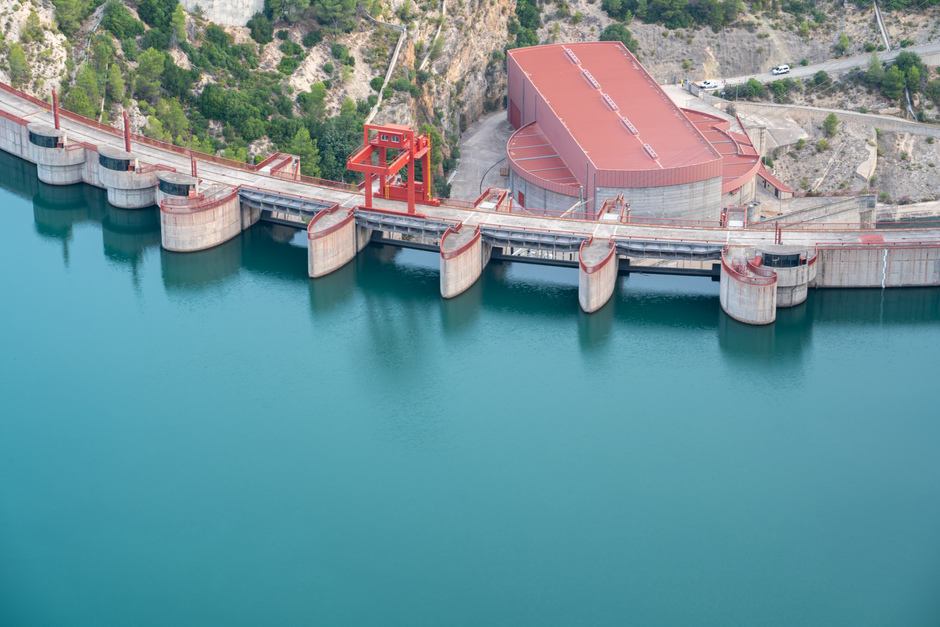 Scenic aerial view of a dam and reservoir in Cortes de Pallás, Comunidad Valenciana, Spain.