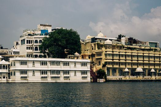 Beautiful view of historic palaces reflecting in Lake Pichola, Udaipur, Rajasthan.