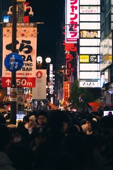 Explore the bustling nightlife of Shibuya, Tokyo with bright neon lights and lively crowds.