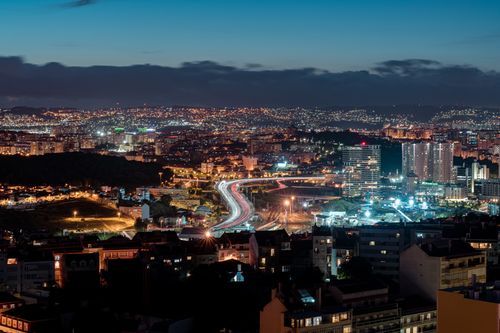 Free A vibrant night view of Lisbon, Portugal, showcasing city lights and urban architecture. Stock Photo