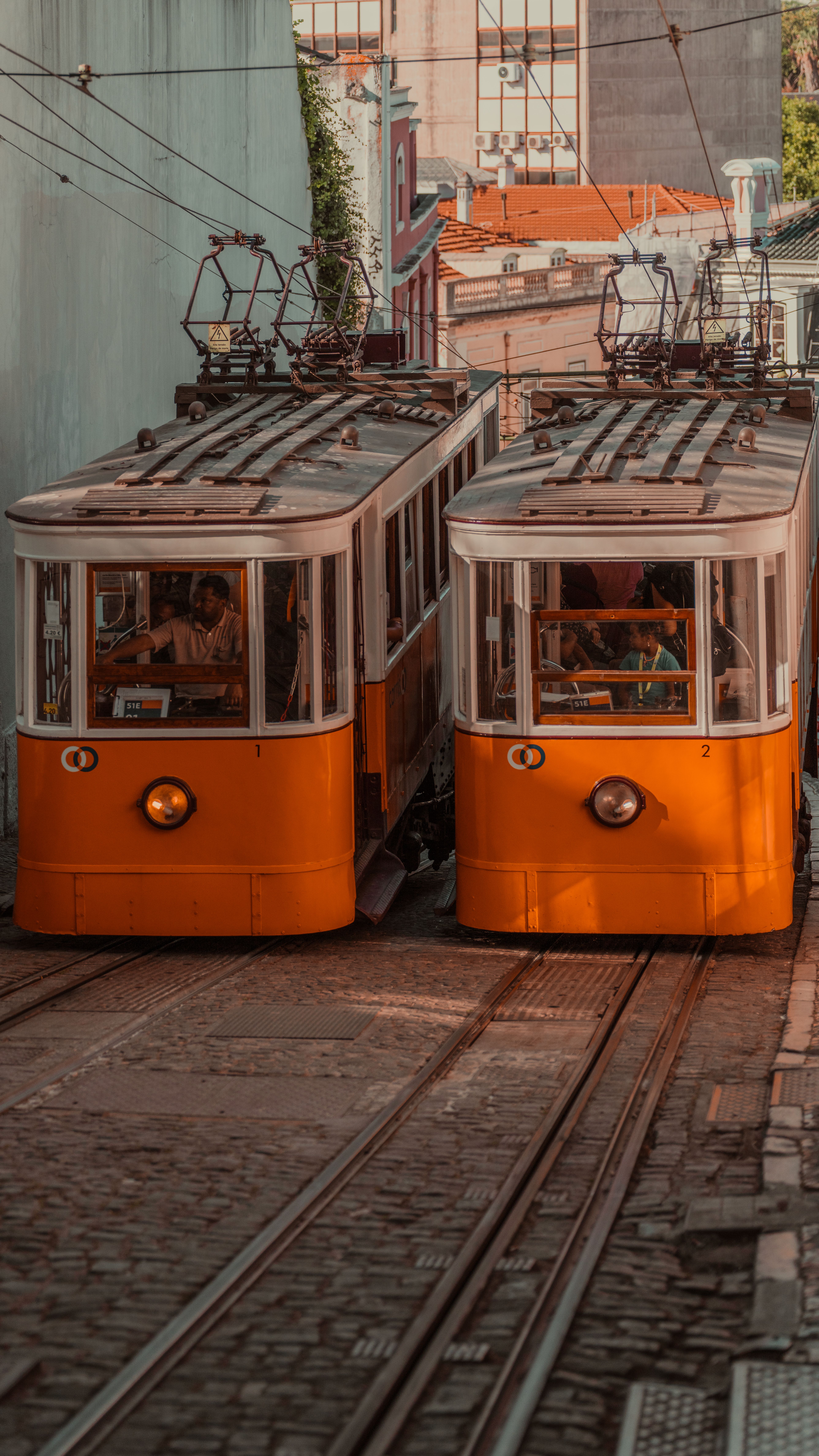 Iconic yellow trams in Lisbon, Portugal showcasing the city's historic charm and vibrant culture.