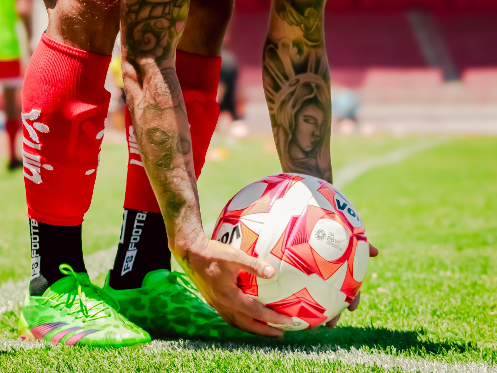 a professional footballer preparing a balanced pre-match meal beside training boots and a water bottle