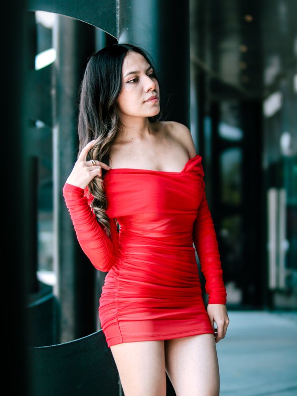 woman wearing red mini dress with y2k accessories night out