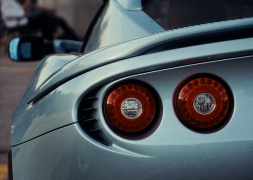 Free Close-up view of a modern blue car's distinctive tail lights in Toronto, Canada. Stock Photo