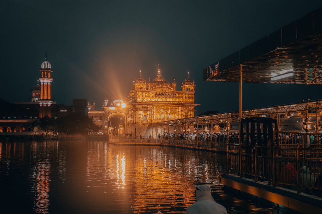 night view of the golden temple reflecting in the water amritsar india