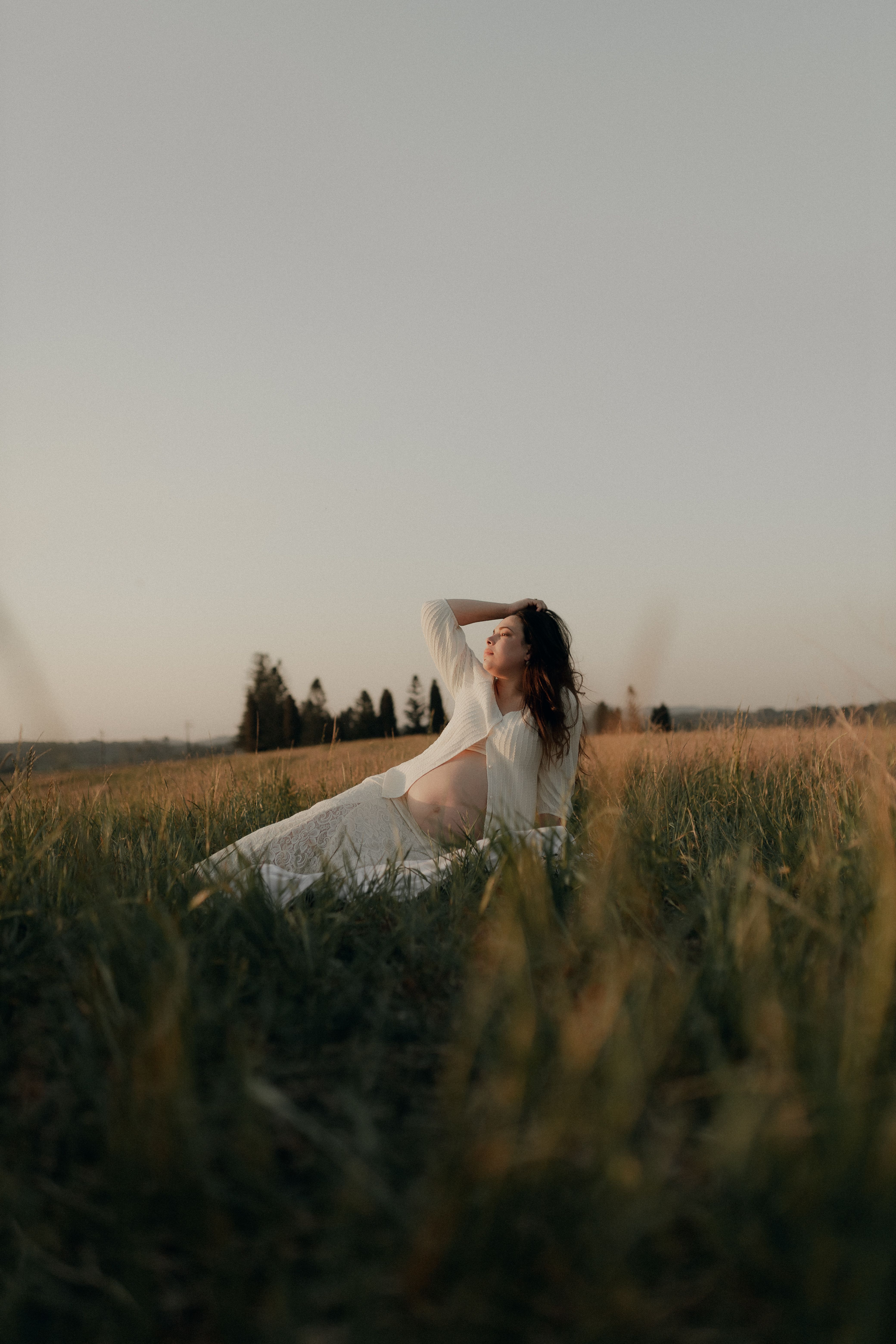 Woman in White Dress Running Through Meadow at Sunset · Free Stock Photo