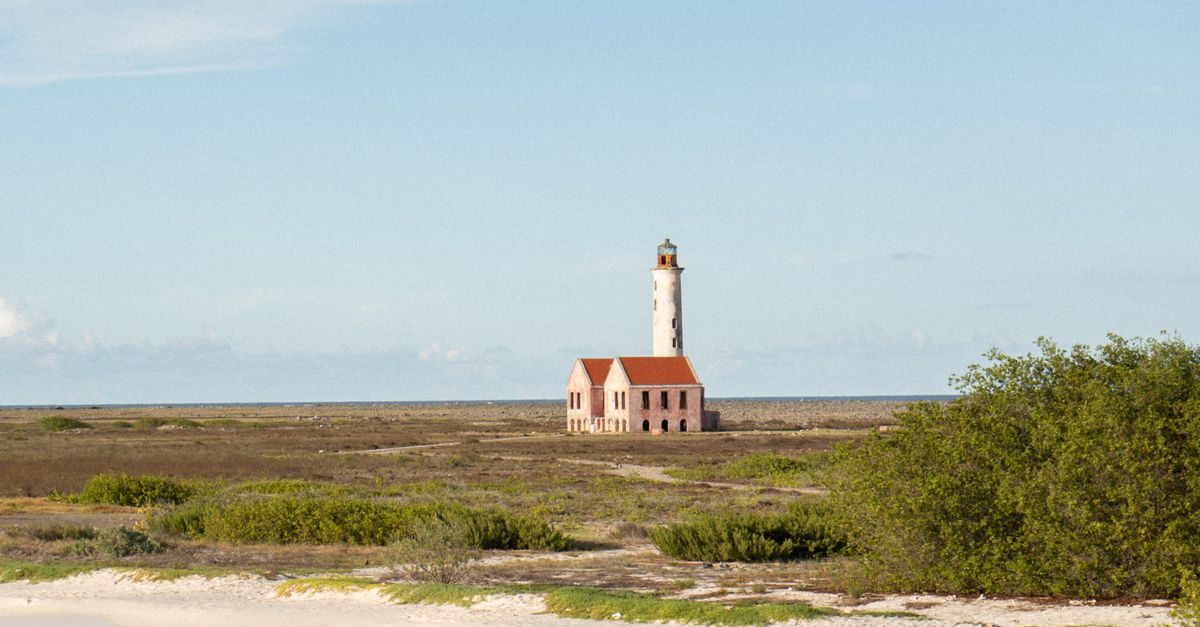 Remote Lighthouse Remote Lighthouse on Klein Curaçao Island Beach · Free Stock Photo
