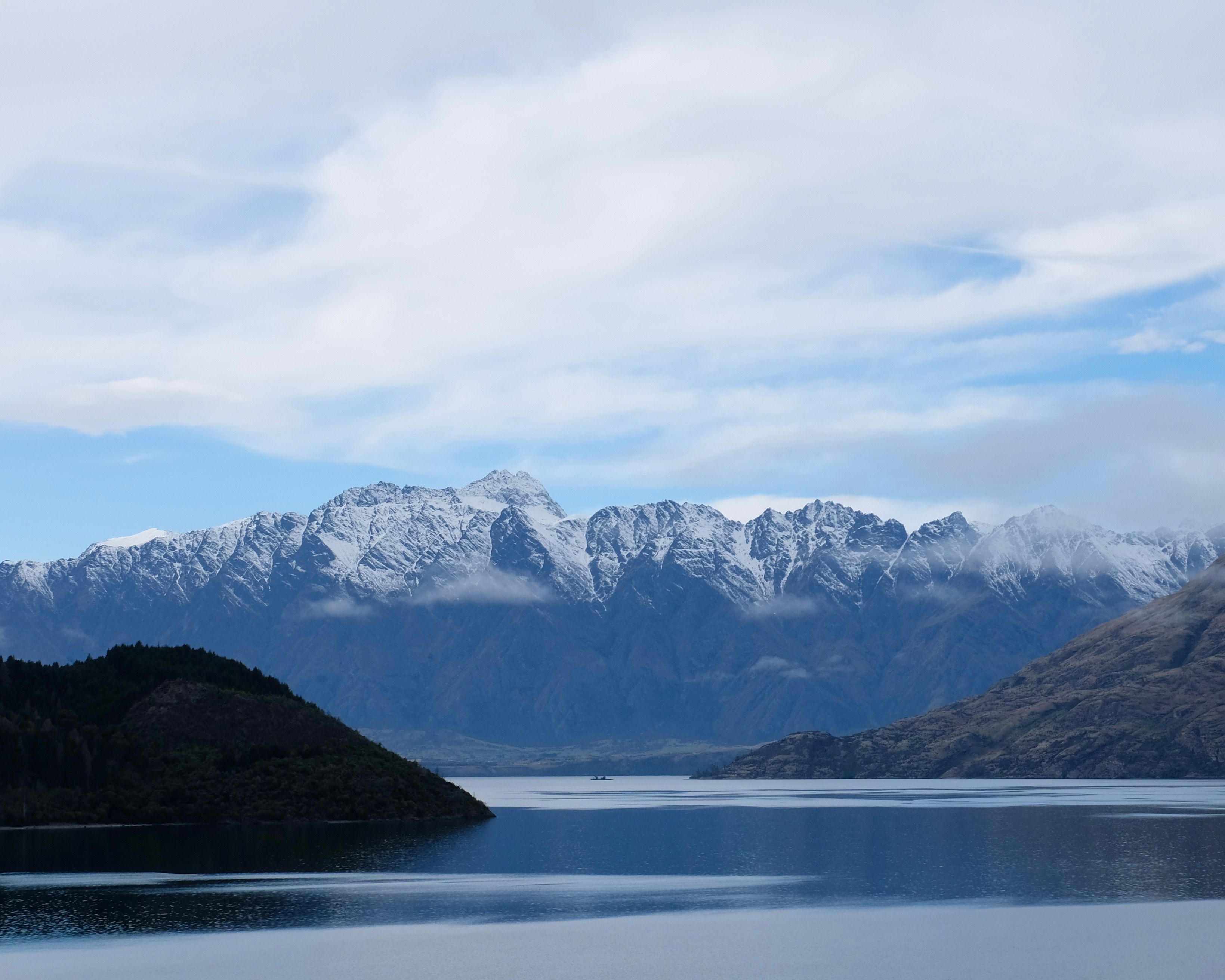 Snow-capped mountain range above Queenstown, New Zealand