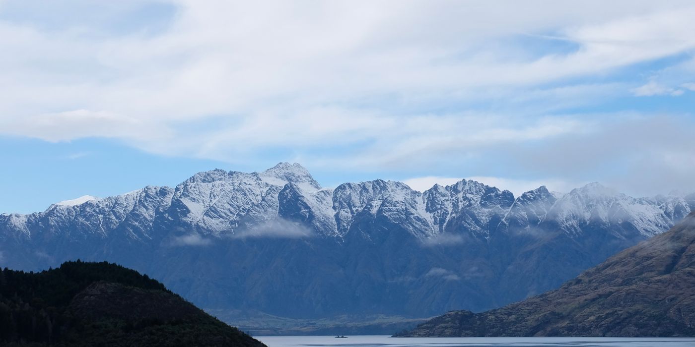 Snow-capped mountain range above Queenstown, New Zealand