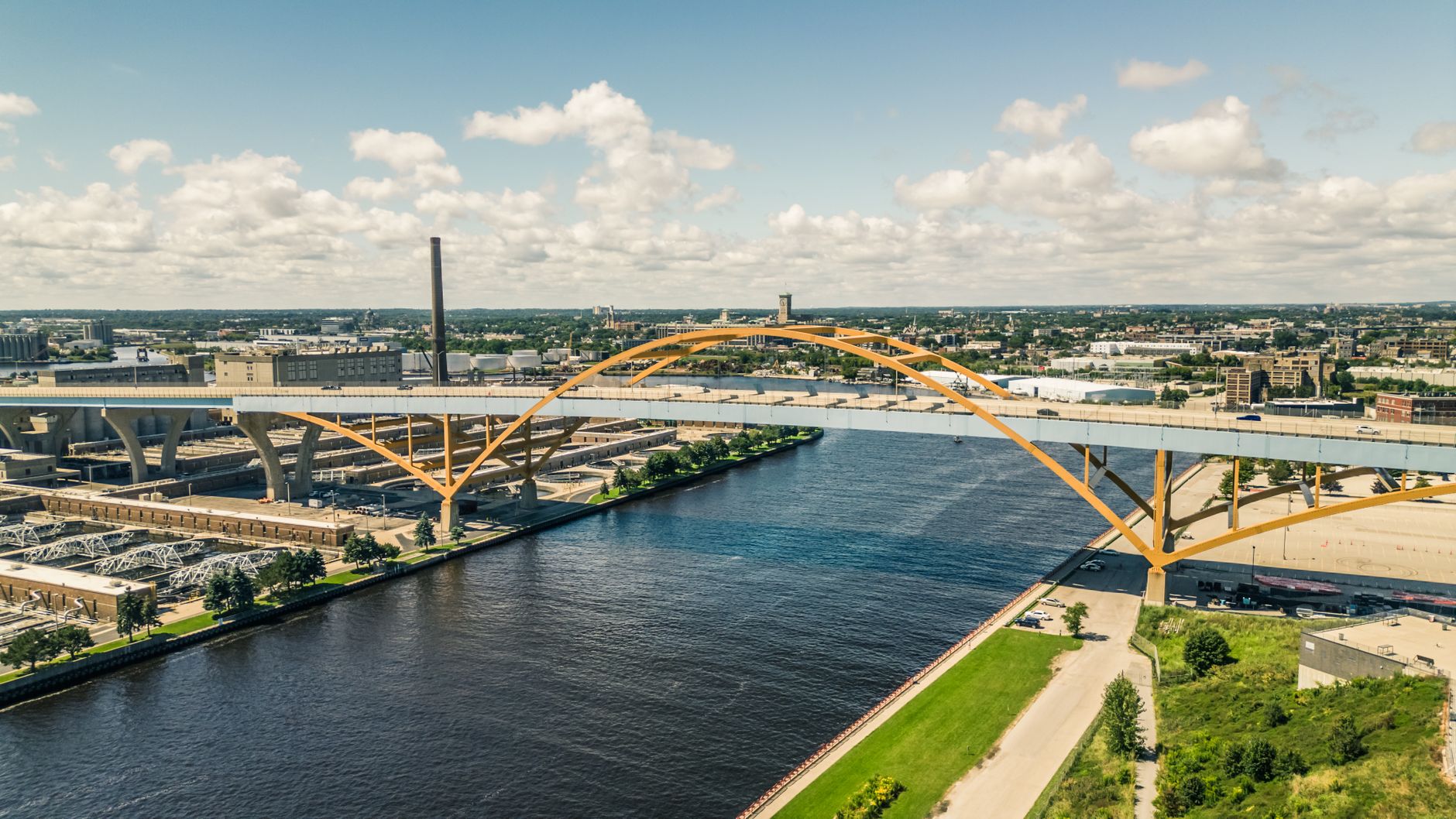 Scenic aerial perspective of Milwaukee's iconic Hoan Bridge over summer waters.