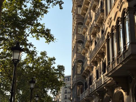 Elegant gothic architecture in Barcelona, Spain, illuminated by the warm glow of sunset.