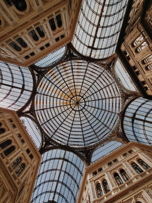 Free View of the intricate glass dome ceiling of Galleria Umberto I in Naples, Italy. Stock Photo