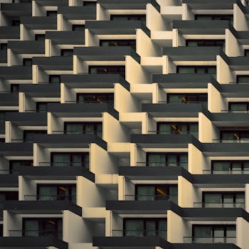 Abstract view of a modern building facade with geometric balcony patterns.