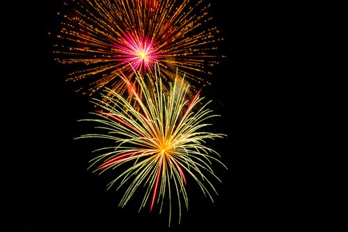 Free Colorful fireworks bursting against a dark night sky, creating a stunning display. Stock Photo