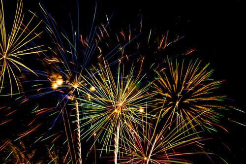 Free Dazzling fireworks light up the night sky with vivid colors, creating a festive atmosphere. Stock Photo