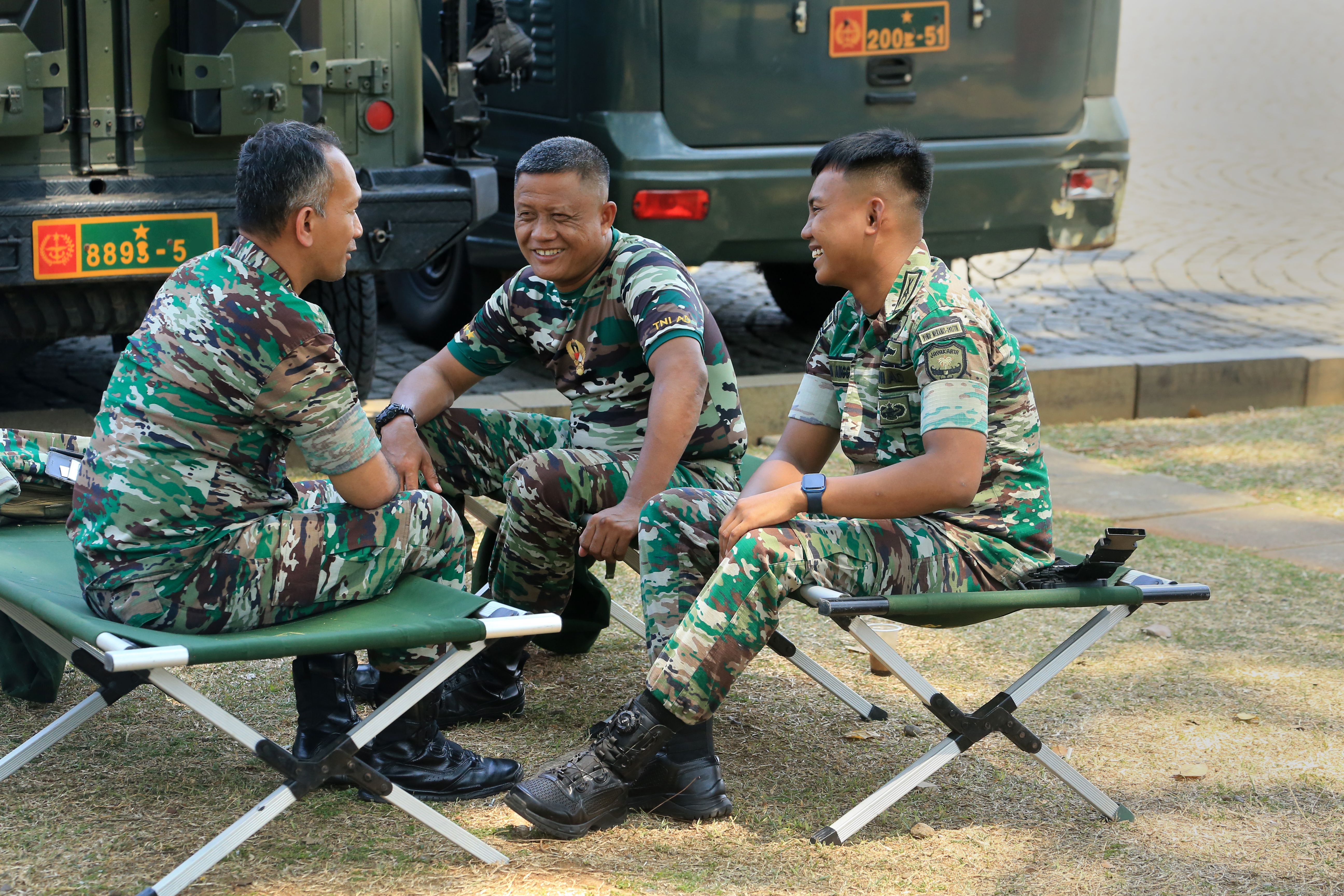 Soldiers in Camouflage Relaxing Outdoors