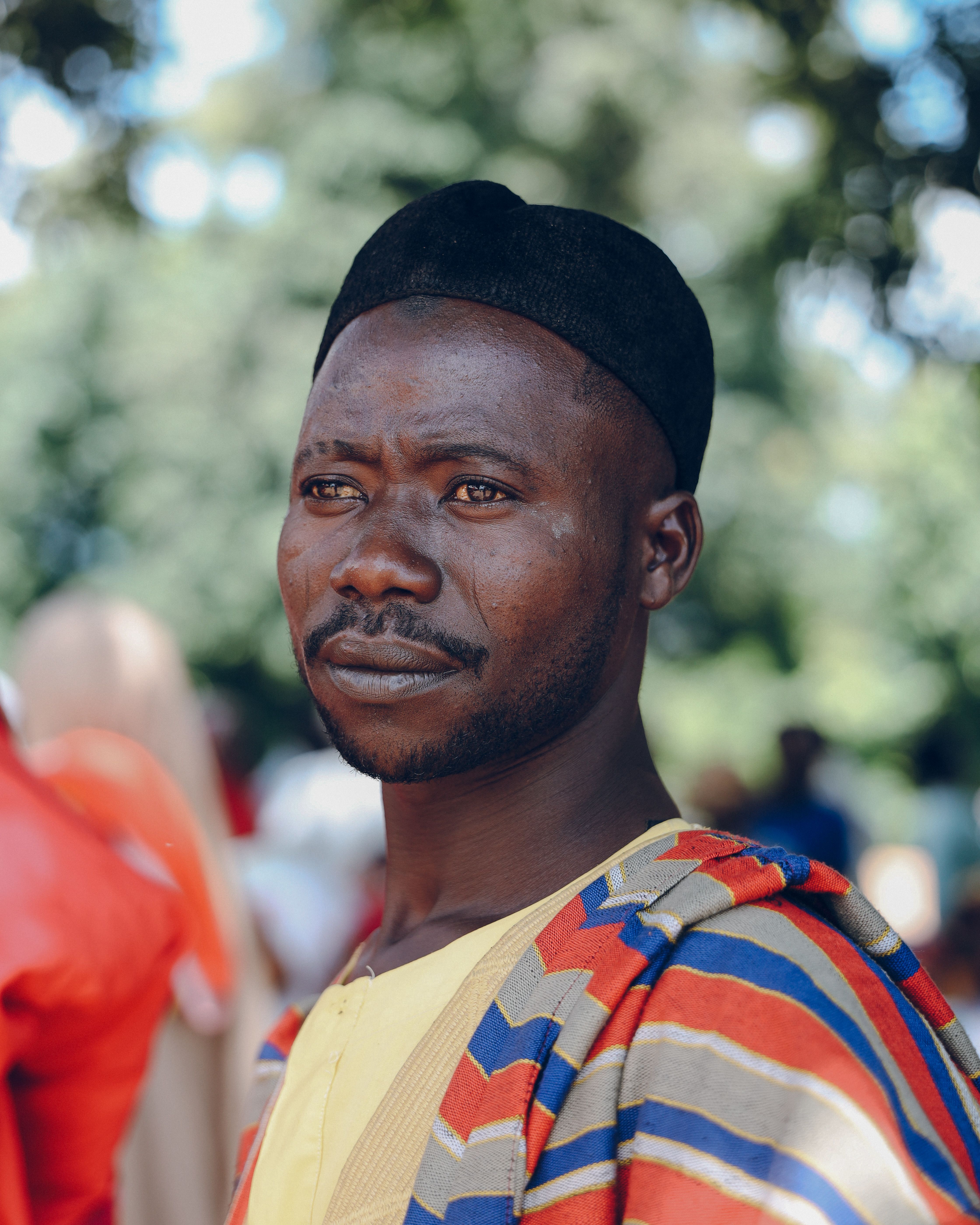 Portrait of Man in Colorful Traditional Outfit Outdoors · Free Stock Photo