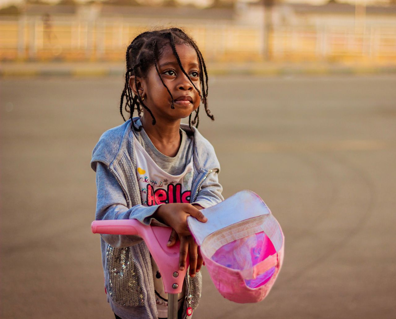 adorable young girl with a scooter outdoors in kaduna nigeria showcasi