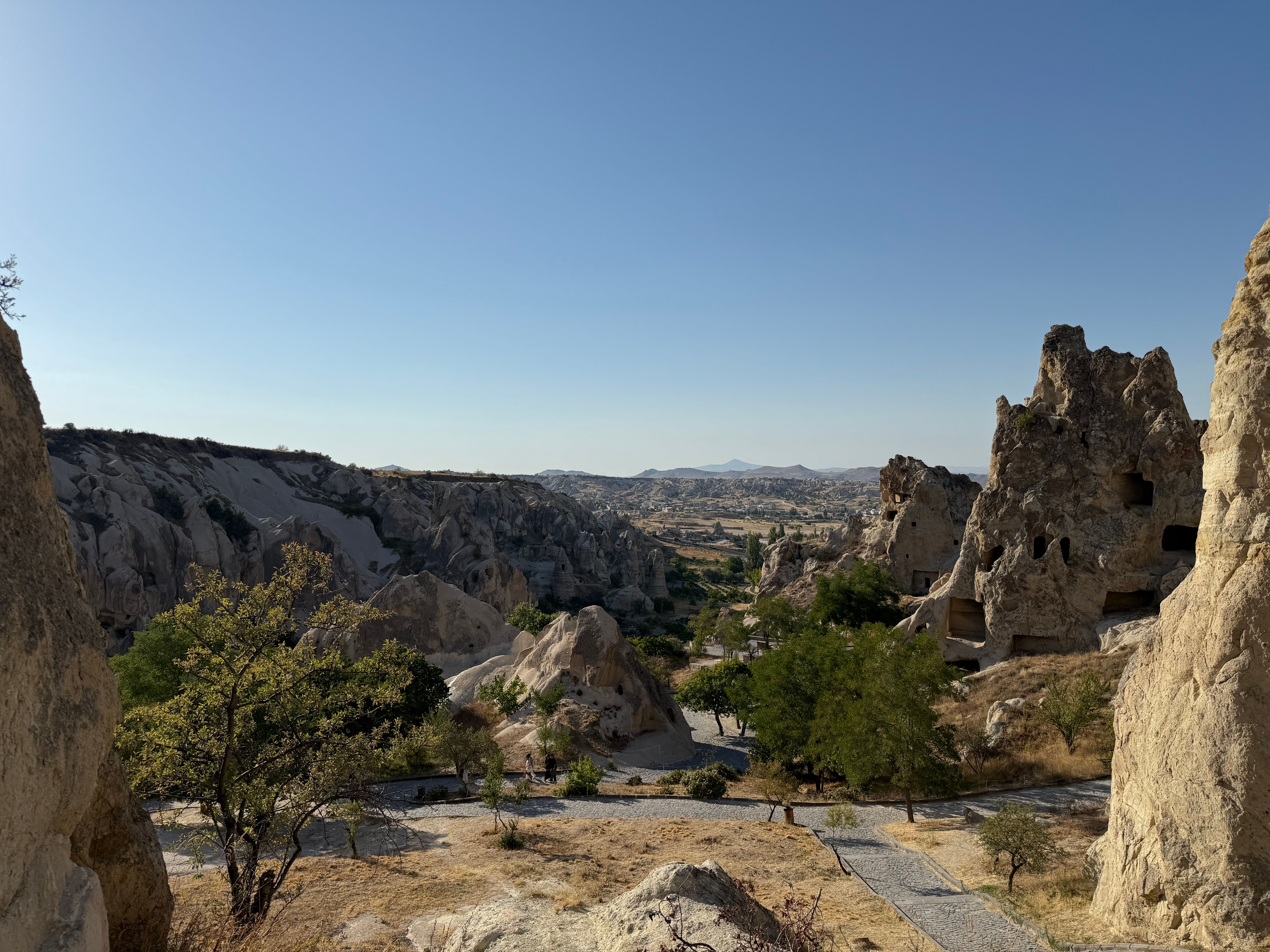 Turkey: Explore the unique rock formations of Cappadocia with clear blue skies and natural landscapes. (stock photo)