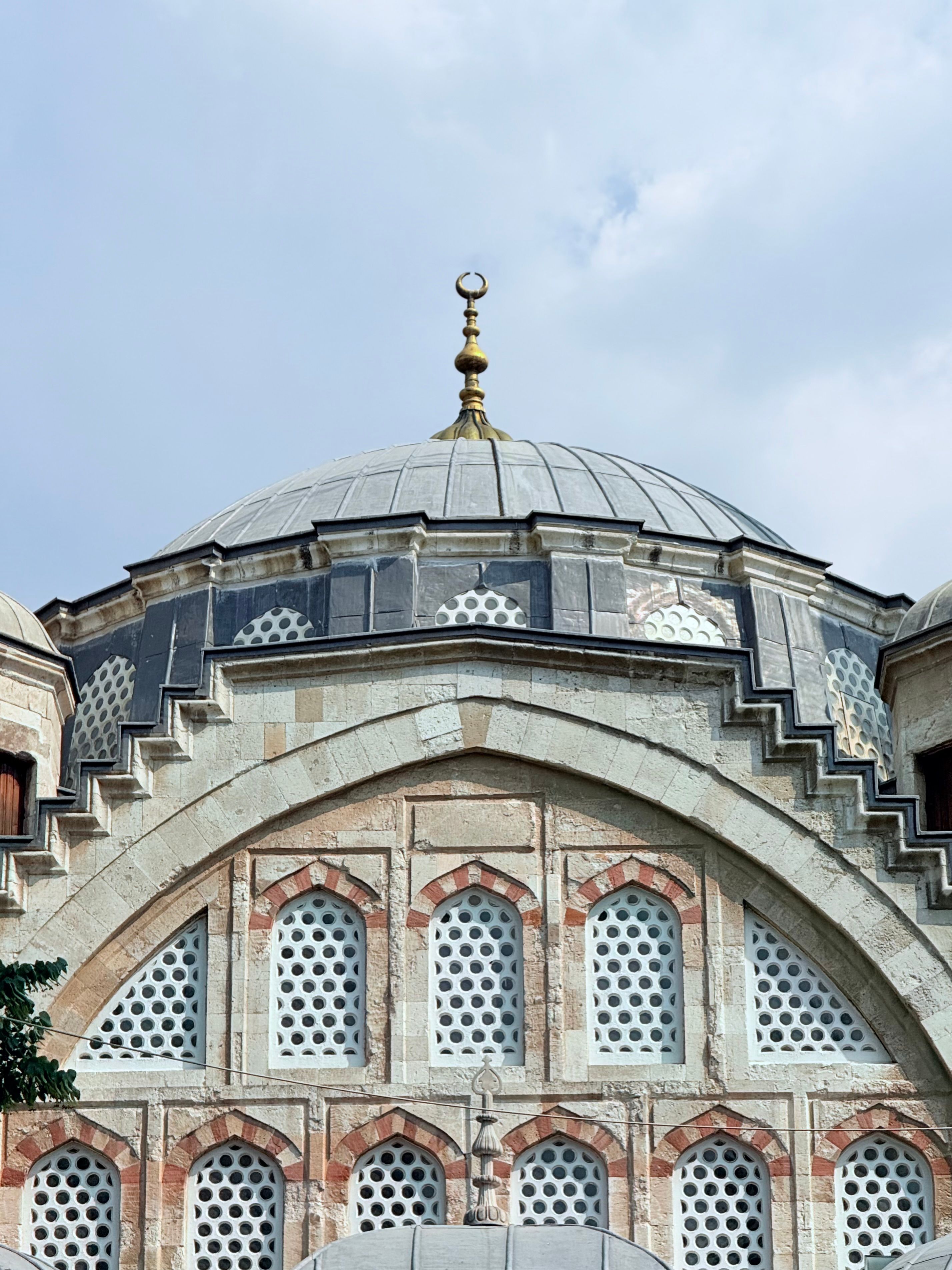 Close-up of a mosque's dome showcasing Ottoman architecture in Manisa, Türkiye.