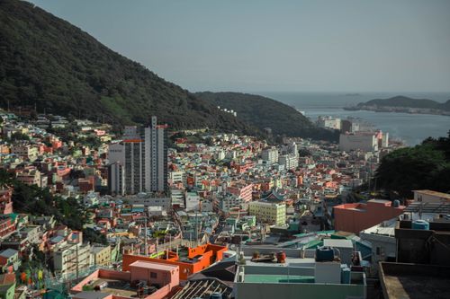 Free Aerial view of Busan's colorful architecture and coastal backdrop in South Korea. Stock Photo
