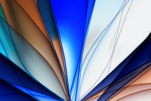 Free Vibrant abstract image featuring flowing, colorful lines in blue, orange, and white. Stock Photo