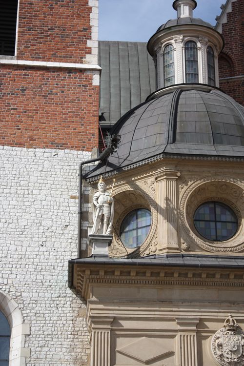 Free Detailed view of Wawel Cathedral's architecture, featuring a dome and historic statue. Stock Photo