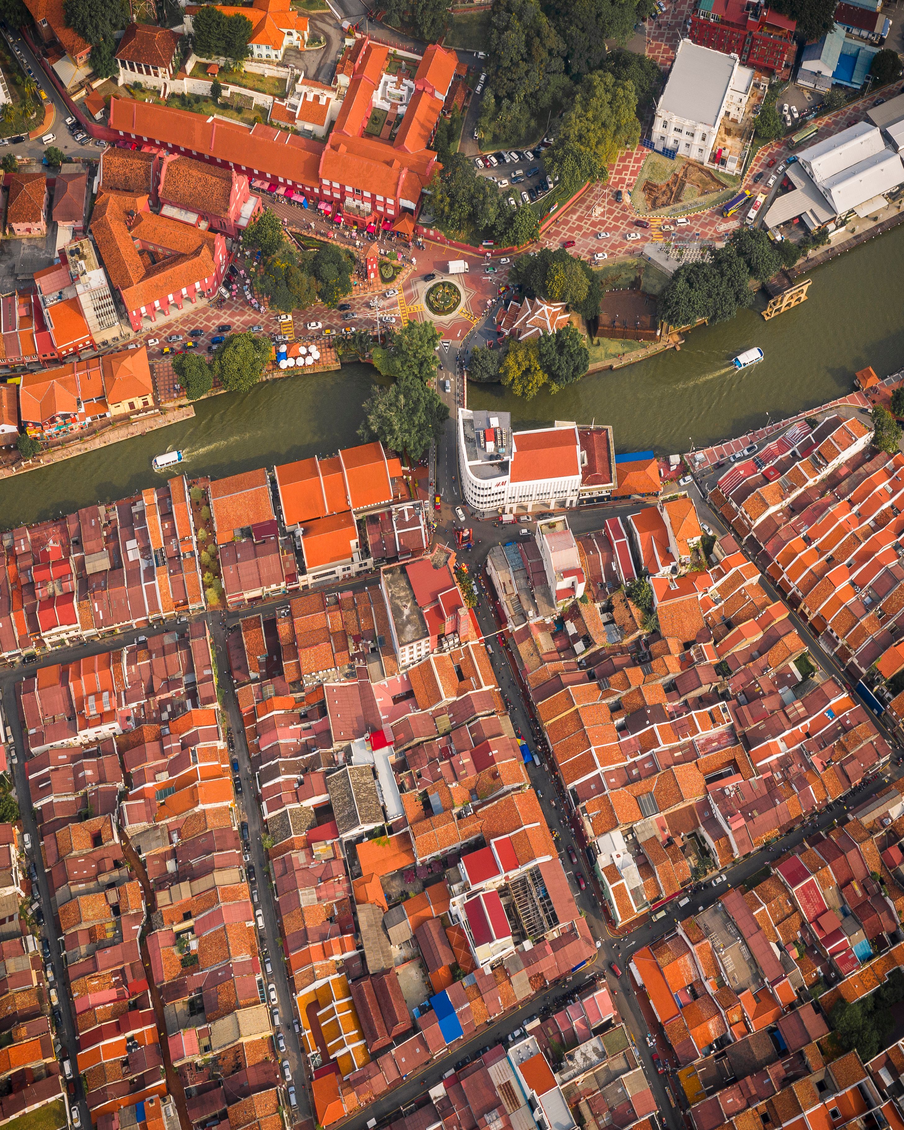 A vibrant aerial shot of the historic cityscape of Malacca, Malaysia, showcasing its unique architecture.