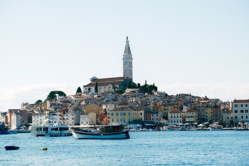 Free Scenic view of Rovinj with its iconic church and colorful coastal houses, Croatia. Stock Photo