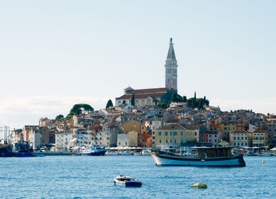 Beautiful coastal town of Rovinj, Croatia, showcasing the iconic Saint Euphemia Church and harbor scenery.