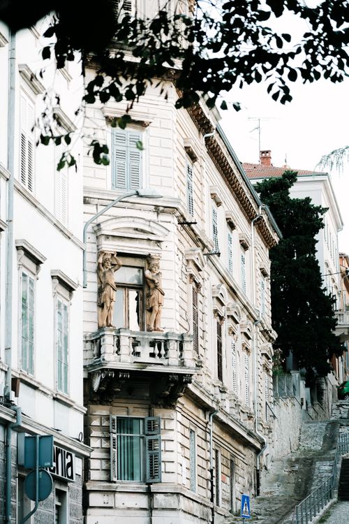 Free A scenic view of historic Croatian architecture with ornate facades on a sloped street in daylight. Stock Photo