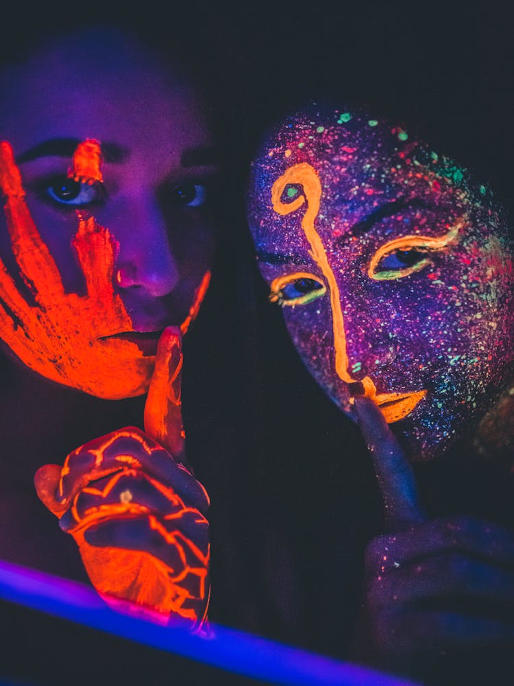 Two Woman With Neon Face Paints