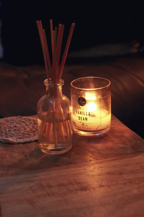Cozy Aromatic Setting with Candle and Diffuser · Free Stock Photo