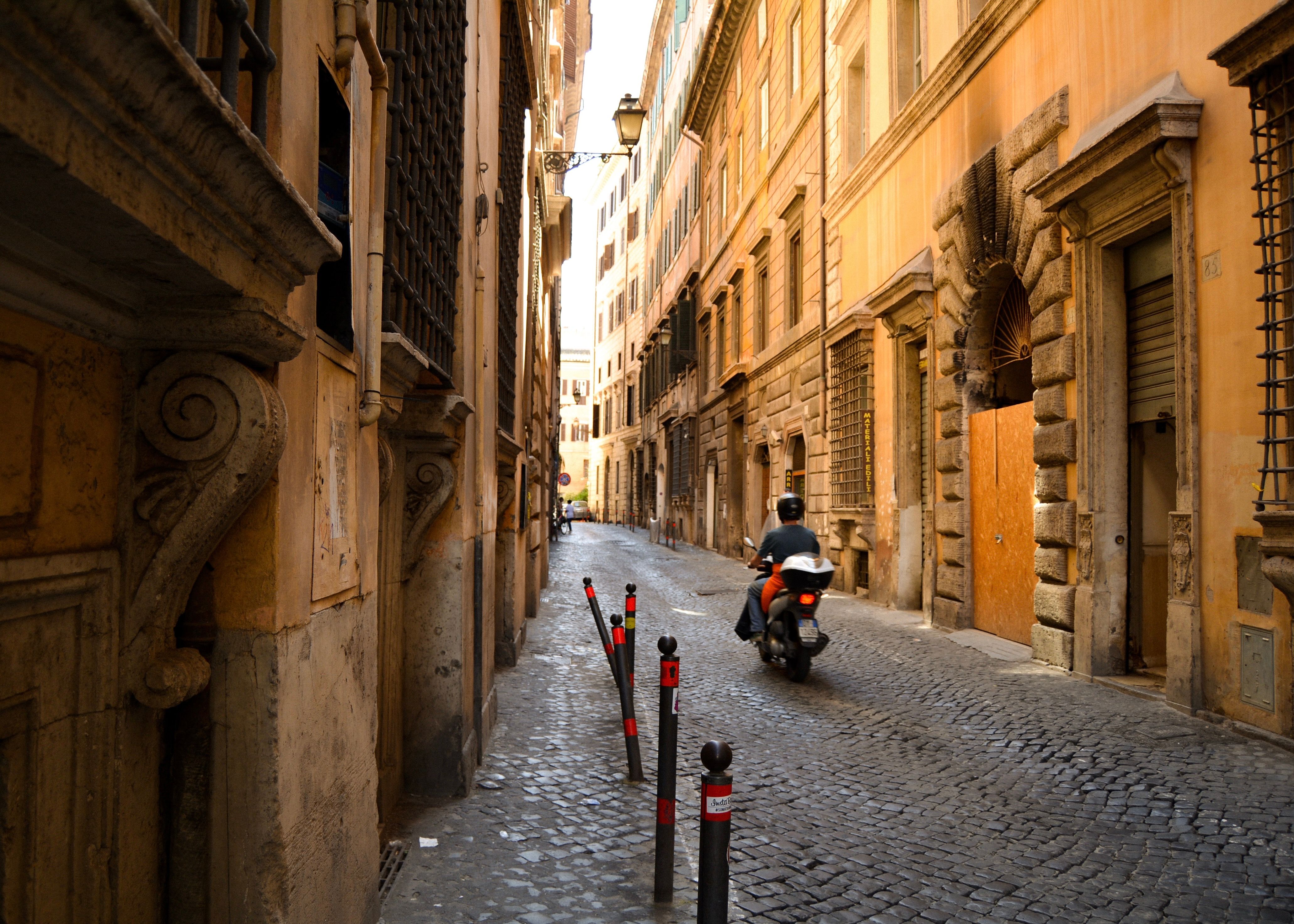 Charming Italian Street with Vespa Rider · Free Stock Photo