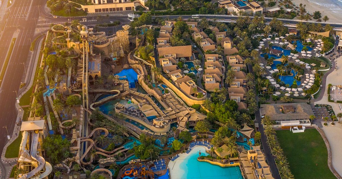 Aerial shot of Atlantis Water Park in Dubai along the coastline, capturing the vibrant attractions.