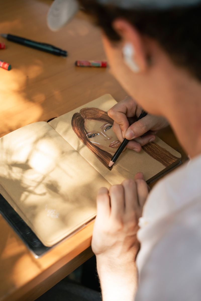 Artist drawing a detailed pencil portrait