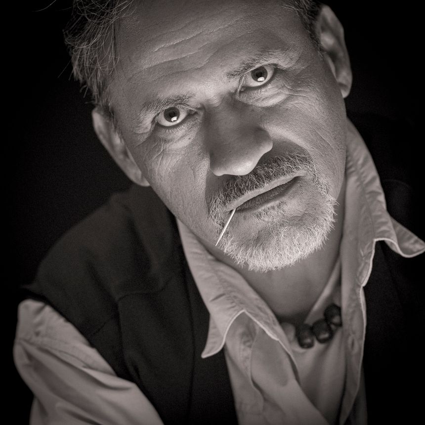 Monochrome studio portrait of an older man, photo by Alvaro Balderas on Pexels