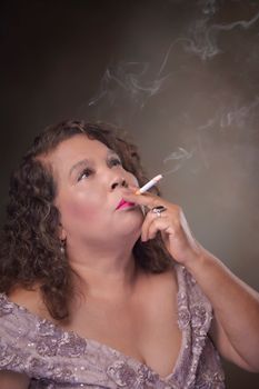 Portrait of a woman exuding elegance with a vintage look, smoking indoors.