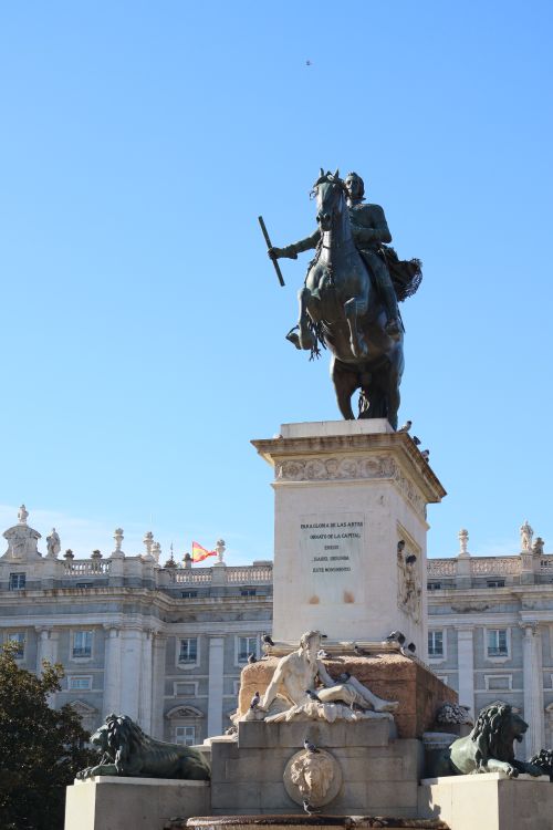 Free Majestic equestrian statue in Plaza de Oriente against clear blue sky in Madrid, Spain. Stock Photo