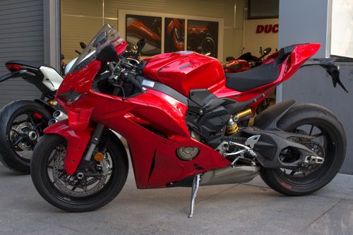 Free Sleek red Ducati sports bike displayed outdoors in Bengaluru, India. Stock Photo