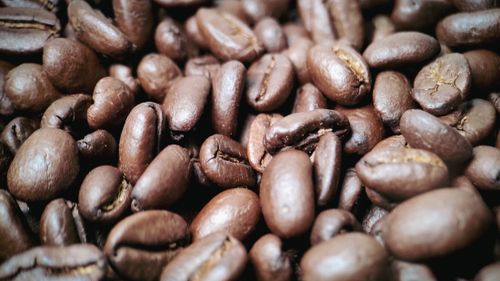 Free Close-up view of roasted coffee beans showcasing rich texture and deep brown color. Stock Photo