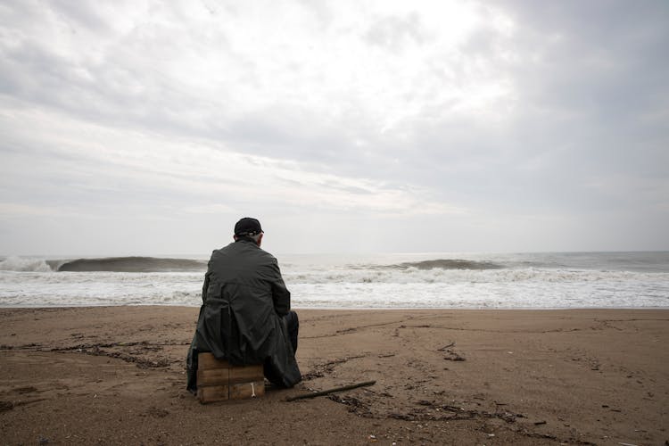 Person Sitting Outdoors