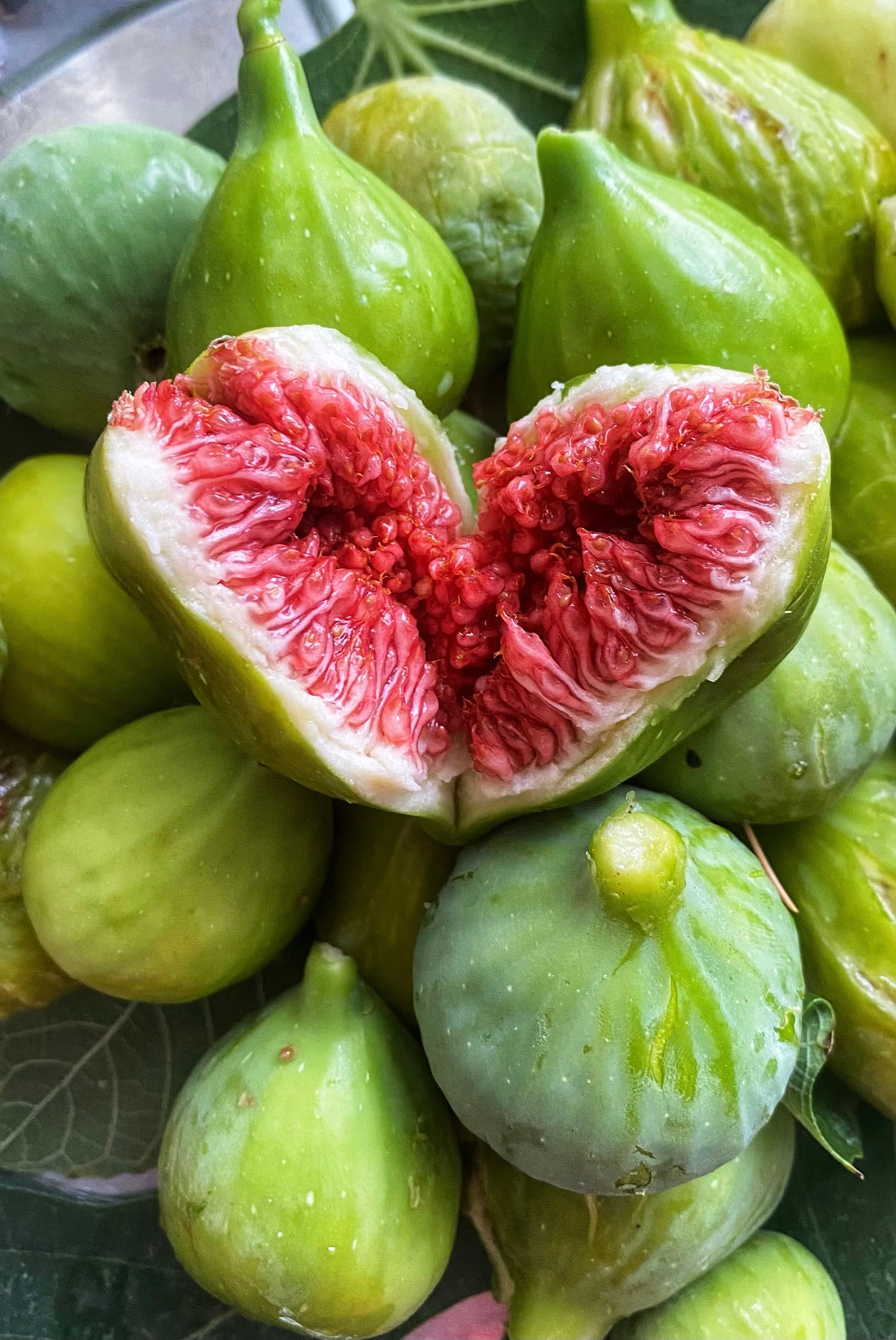Fresh Green Figs with a Juicy Split Fig · Free Stock Photo