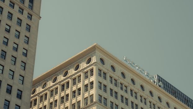 Classic architectural details of Chicago's historic Motorola building with clear sky.